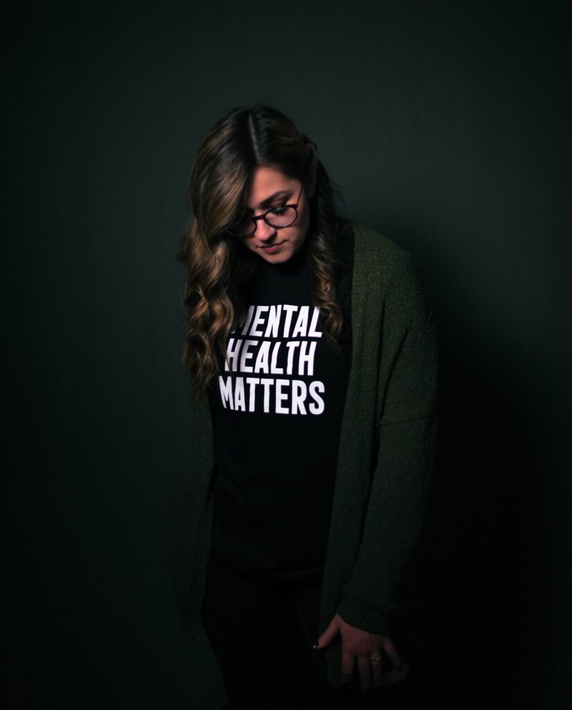 Woman wearing a t-shirt that says mental health matters