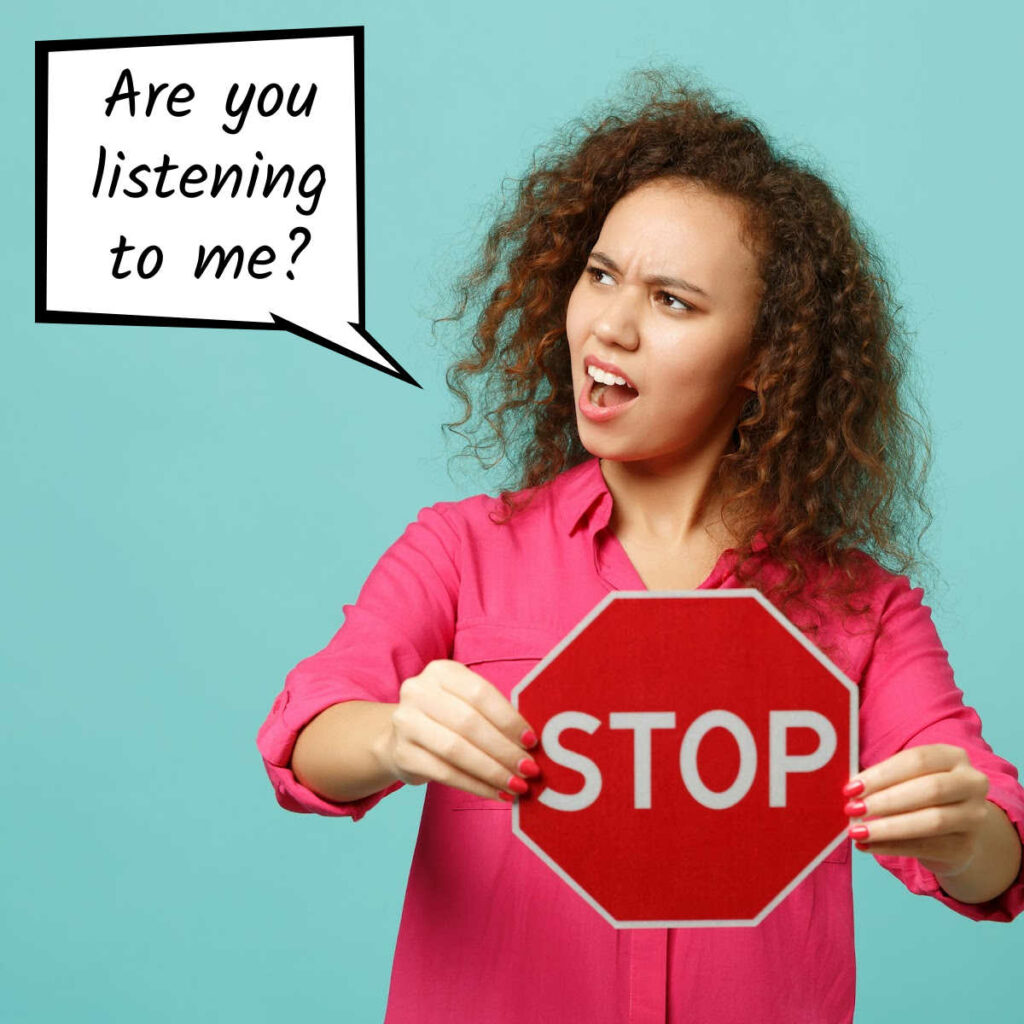 Woman holding a stop sign with thought bubble that says Are you listening?