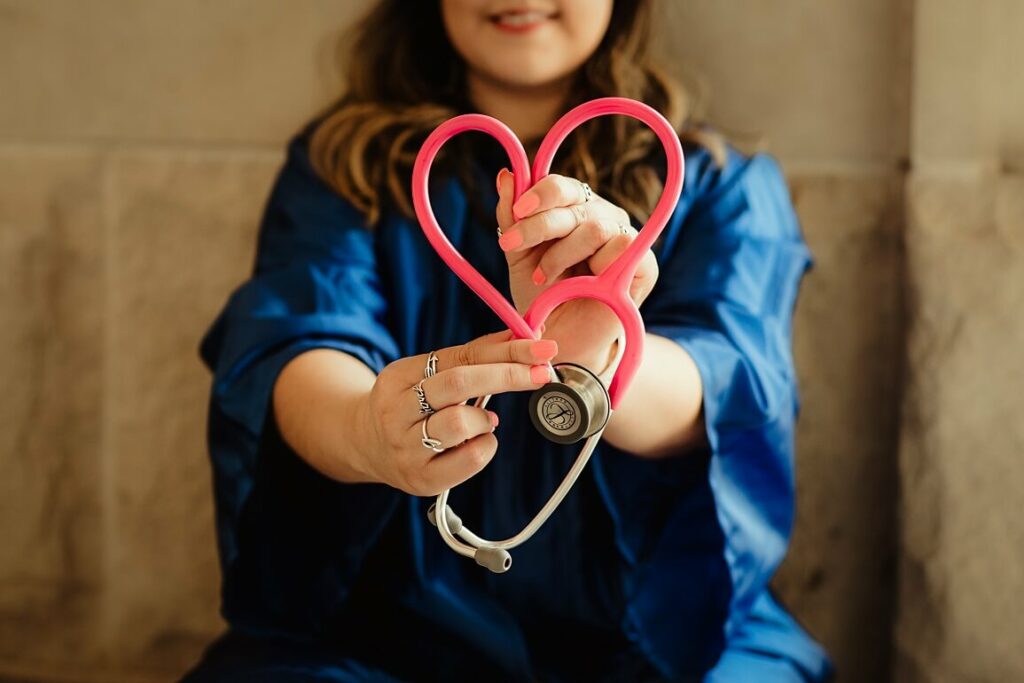 Image of a doctor holding a stethoscope shaped like a heart